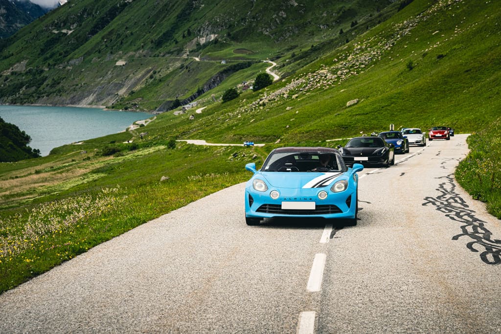 gotrip roadtrip balade voitures sportives GT supercars route grandes alpes montagne cols Alpine A110 Porsche Maserati Corvette BMW Honda Lotus Aston Martin Mazda 370z Renault RS Mustang Ferrari McLaren Lamborghini tour auto roadbook 2024 2025 2026 GOTRIP