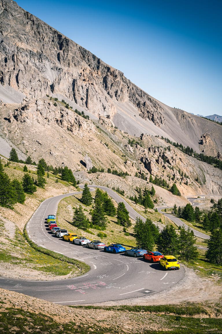 gotrip roadtrip balade voitures sportives GT supercars route grandes alpes montagne cols Alpine A110 Porsche Maserati Corvette BMW Honda Lotus Aston Martin Mazda 370z Renault RS Mustang Ferrari McLaren Lamborghini tour auto roadbook 2024 2025 2026 GOTRIP